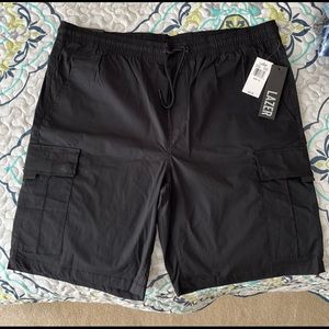 Men black elastic waistband shirts.  XL new with tags.